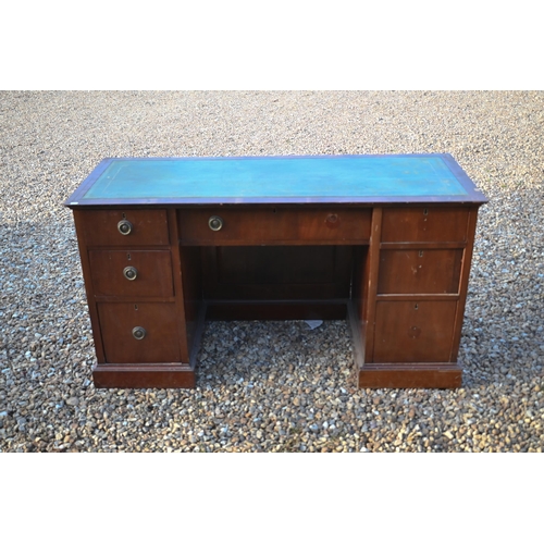 249 - An Edwardian mahogany desk with green leather-top over seven drawers, on plinths, 139 cm x 54 cm x 7... 