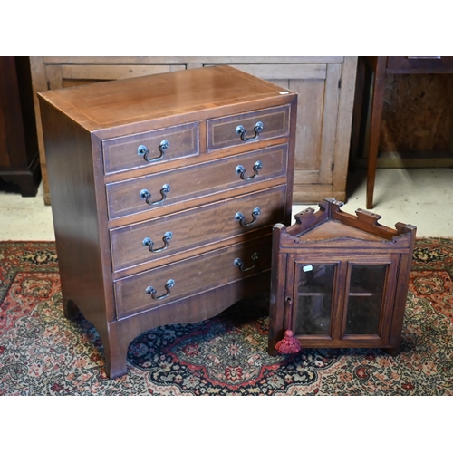 250 - A small reproduction chest with two short over three long graduated drawers, 61 x 38 x 72 cm high to... 