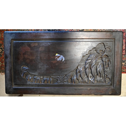 256 - A 1930's Chinese stained and carved camphorwood trunk, with original tray to the interior and brass ... 