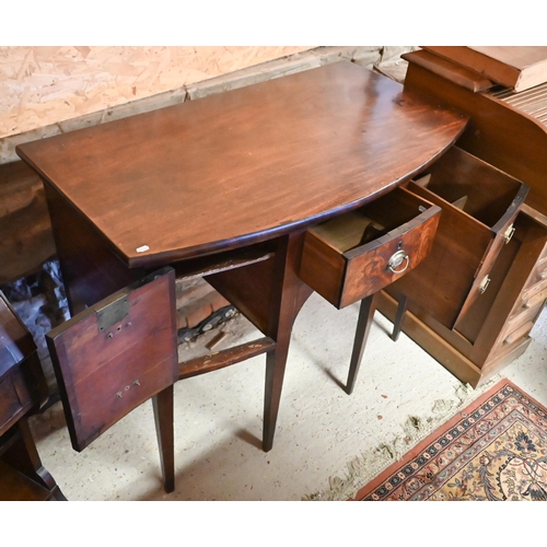 258 - A compact George III mahogany bowfront sideboard, centred by a drawer over an arched apron and flank... 