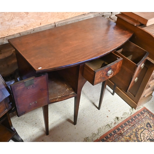 258 - A compact George III mahogany bowfront sideboard, centred by a drawer over an arched apron and flank... 