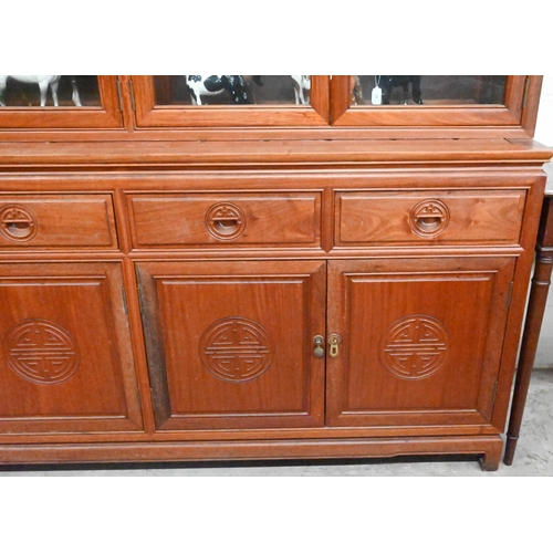 267 - # A Chinese hardwood cabinet bookcase the top with four glazed doors (lacking shelves) on base with ... 