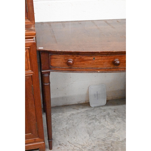 268 - A 19th century mahogany bowfront side table with twin frieze drawers, on ring-turned supports, 107cm... 