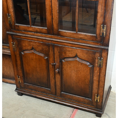 273 - Titchmarsh & Goodwin oak bookcase with glazed doors enclosing adjustable shelves over pair of pa... 