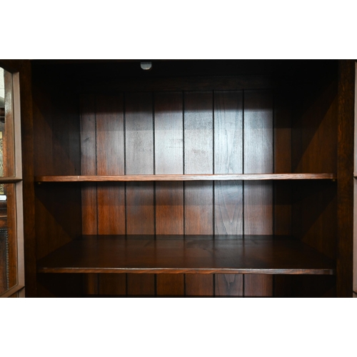 273 - Titchmarsh & Goodwin oak bookcase with glazed doors enclosing adjustable shelves over pair of pa... 