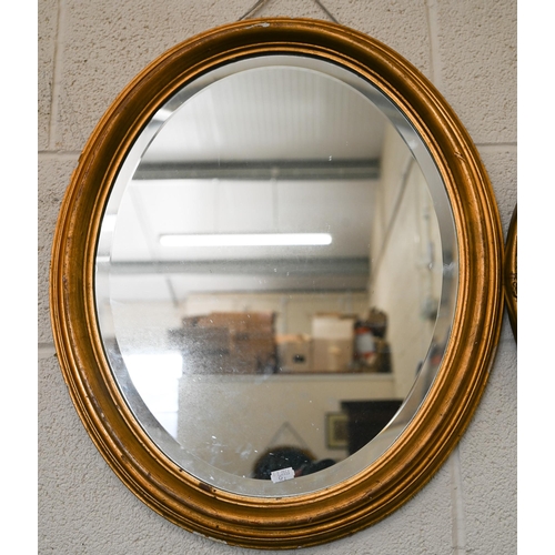 279 - A vintage French style wall mirror in decorative gilt frame. 44 cm diam to/w a gilt framed oval mirr... 