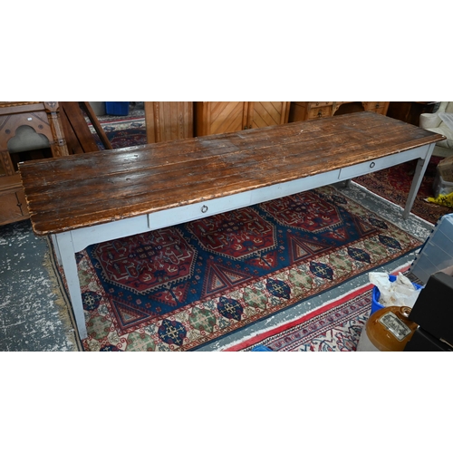 A country house servant's hall dining table with planked pine top on painted base with two frieze drawers and square tapering supports, 300 x 80cm x 77cm h