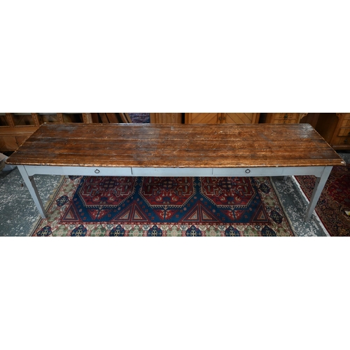 280 - A country house servant's hall dining table with planked pine top on painted base with two frieze dr... 