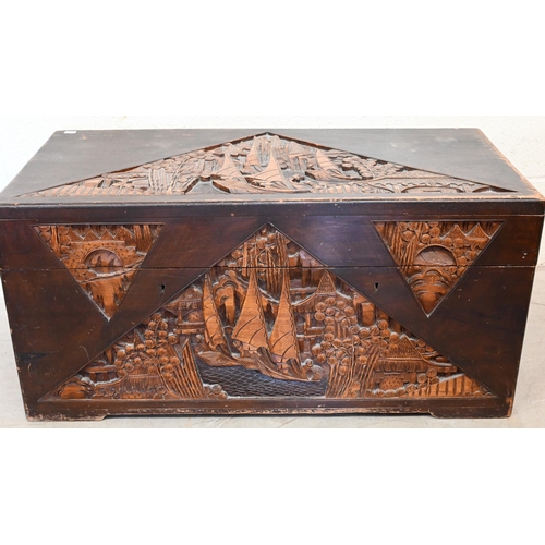 283 - A mid 20th century Chinese carved hardwood blanket chest, camphor lined interior with lift-out tray,... 