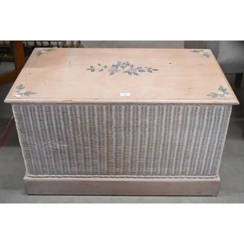 287 - A lime-washed floral painted beech blanket chest with wicker panelled sides and brass handles, 90 cm... 