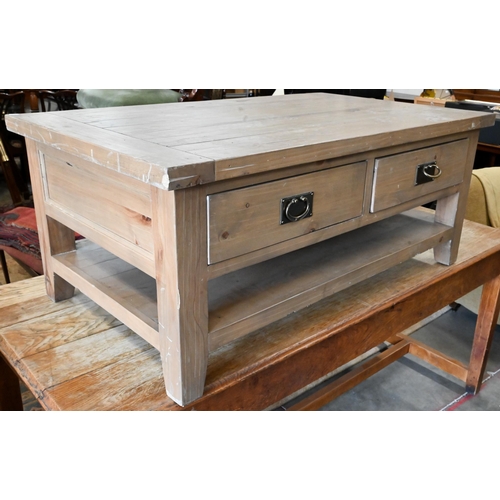 296 - A stained pine coffee table with two drawers to each side and an open undertier, 120 cm wide x 70 cm... 