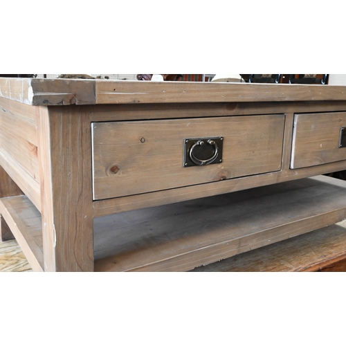 296 - A stained pine coffee table with two drawers to each side and an open undertier, 120 cm wide x 70 cm... 