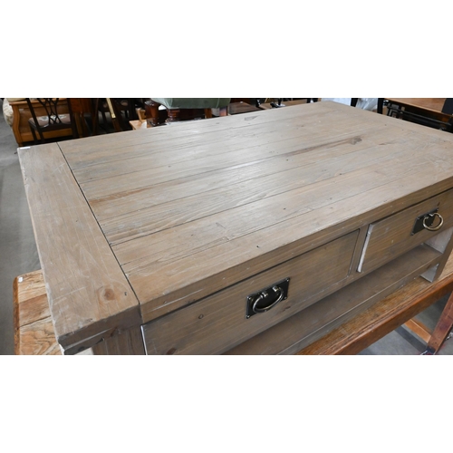 296 - A stained pine coffee table with two drawers to each side and an open undertier, 120 cm wide x 70 cm... 