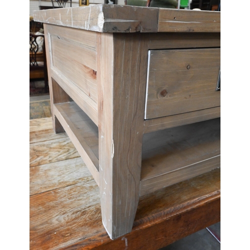 296 - A stained pine coffee table with two drawers to each side and an open undertier, 120 cm wide x 70 cm... 