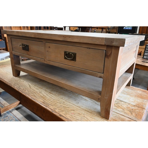 296 - A stained pine coffee table with two drawers to each side and an open undertier, 120 cm wide x 70 cm... 