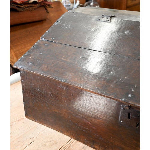 363 - An 18th century oak slope top clerks desk, the interior fitted with three drawers, 90 cm wide x 50 c... 