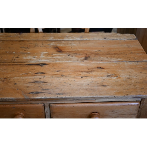 369 - A waxed pine kitchen/pantry side table with three drawers raised on turned supports, 150 cm wide x 7... 