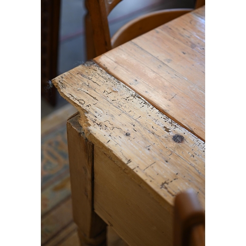 369 - A waxed pine kitchen/pantry side table with three drawers raised on turned supports, 150 cm wide x 7... 