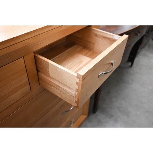 374 - A contemporary light oak chest of two short over three long drawers, 90 cm wide x 45 cm deep x 94 cm... 