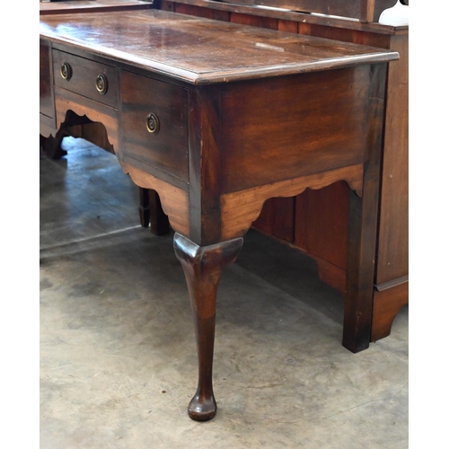 381 - A 19th century mahogany dressing table with three drawers around shaped niche raised on cabriole sup... 