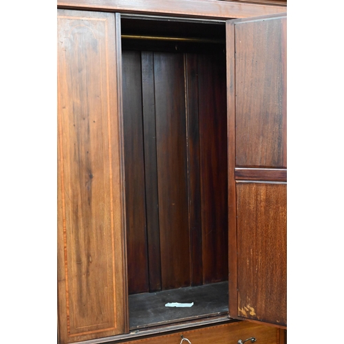 383 - Edwardian walnut and satin-banded wardrobe, the single door inset with bevelled oval mirror on base ... 