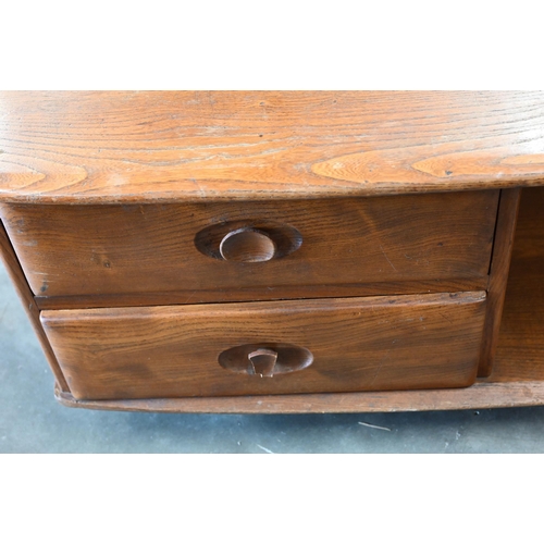 390 - An Ercol (attributed/unmarked) elm Pandora coffee table, with two drawers and open sides on casters,... 