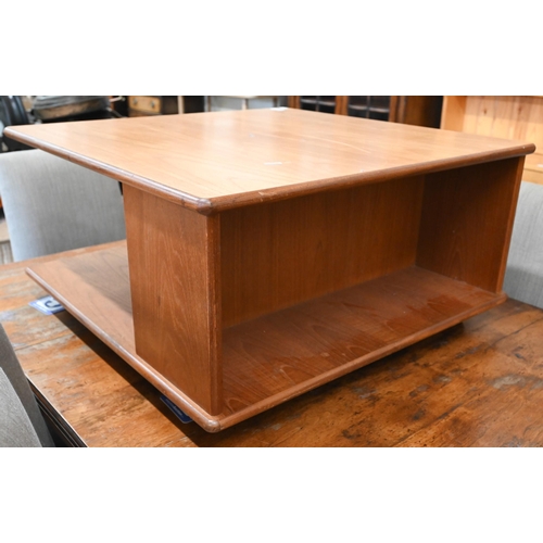 392 - A 1980s teak G-Plan coffee table with open compartmentalised sides on roller casters, 80 x 80 x 40 c... 