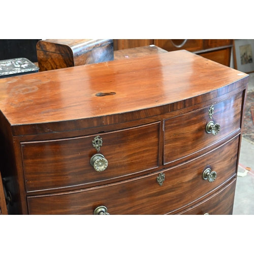 400 - A small 19th century mahogany bowfront chest with two short over two long drawers on splayed bracket... 