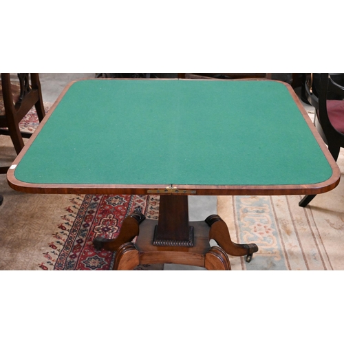 405 - A Regency mahogany card table with folding rosewood banded top (baise lined), on tapering rectangula... 