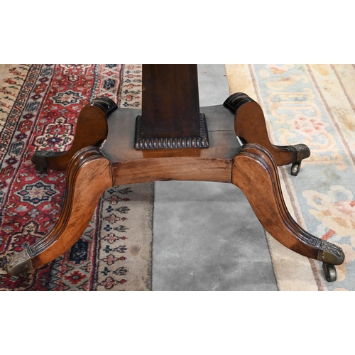 405 - A Regency mahogany card table with folding rosewood banded top (baise lined), on tapering rectangula... 