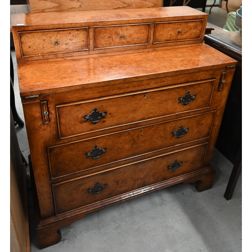 406 - A burr walnut writing desk chest of three drawers and a folding top with gilt tooled green leather s... 