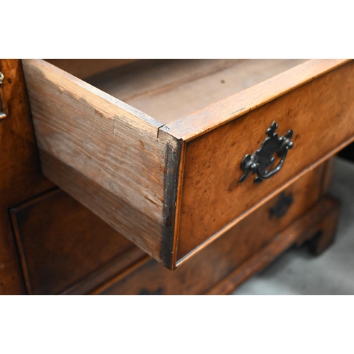 406 - A burr walnut writing desk chest of three drawers and a folding top with gilt tooled green leather s... 