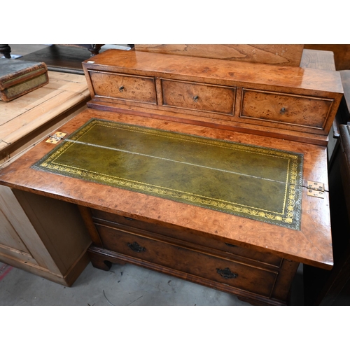 406 - A burr walnut writing desk chest of three drawers and a folding top with gilt tooled green leather s... 