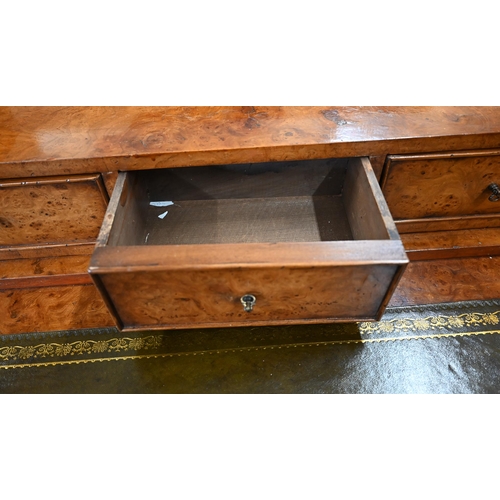 406 - A burr walnut writing desk chest of three drawers and a folding top with gilt tooled green leather s... 