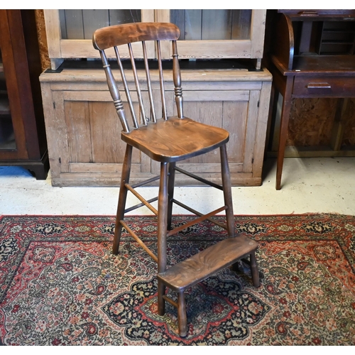 410 - A mid 20th century oak clerk's desk with hinged sloped top on a panelled base with high chair, 98 cm... 