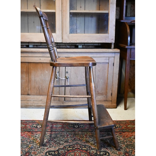 410 - A mid 20th century oak clerk's desk with hinged sloped top on a panelled base with high chair, 98 cm... 