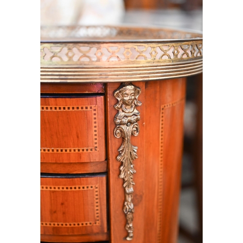 418 - A reproduction French kingwood inlaid oval side table with pierced brass gallery and three drawers, ... 