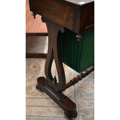 419 - A Victorian rosewood sewing table with frieze drawer and pleated fabric box drawer on lyre supports,... 