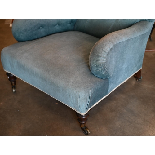 422 - A 19th century mahogany framed country house low armchair in blue dralon button back upholstery, 98 ... 