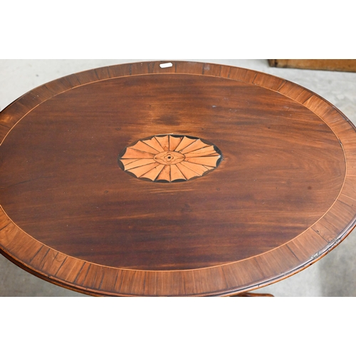 426 - An Edwardian mahogany inlaid oval tilt-top occasional table on tripod base, 68 cm wide x 50 cm deep ... 