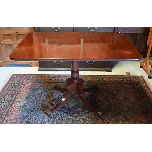 449 - A small Victorian mahogany tilt top breakfast table, the rectangular top raised on a turned support ... 