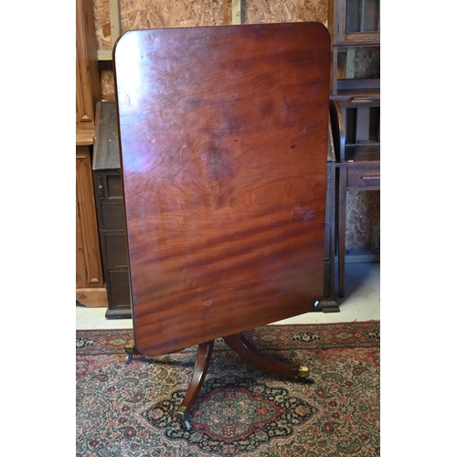 449 - A small Victorian mahogany tilt top breakfast table, the rectangular top raised on a turned support ... 