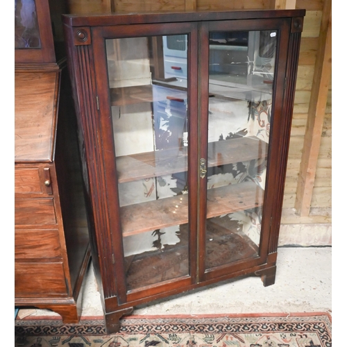 452 - # An Art Deco mahogany display cabinet, with two glazed panel doors, raised on shaped bracket feet, ... 