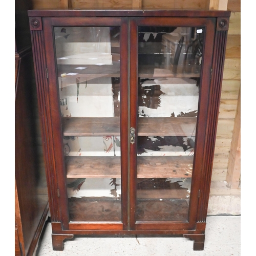 452 - # An Art Deco mahogany display cabinet, with two glazed panel doors, raised on shaped bracket feet, ... 