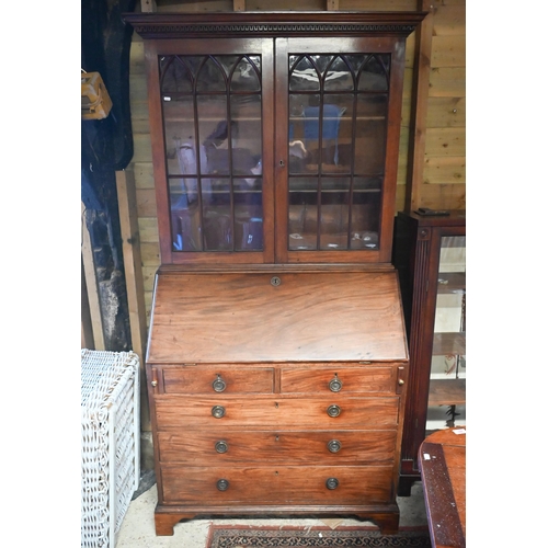 453 - A 19th century mahogany fall front bureau bookcase, with twin arched glazed cabinet doors over a fit... 