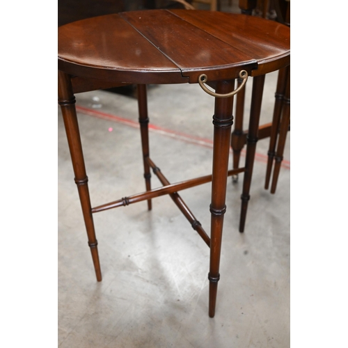 465 - A mahogany side table with gilt tooled leather top and two nesting drop leaf tables, all with 'bambo... 