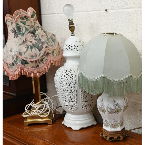 487 - A brass table lamp and two ceramics lamps (3)