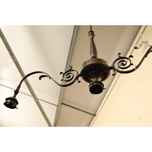 490 - A bronzed twin-branch ceiling light with three fittings