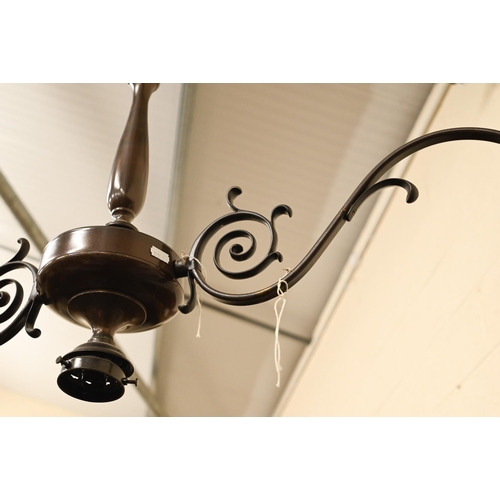 490 - A bronzed twin-branch ceiling light with three fittings