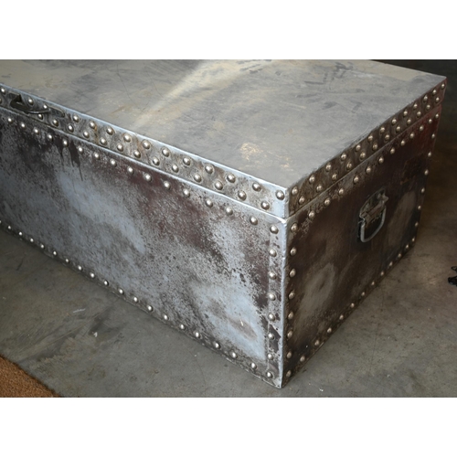 493 - A studded metal trunk, 122cm wide